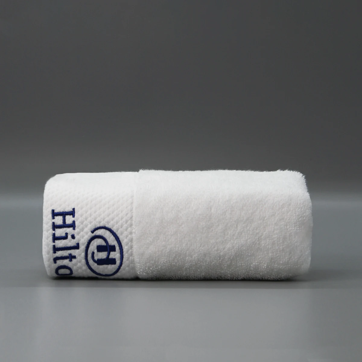 Toalla de baño Terry bordada blanca 100% algodón toalla de mano para hotel toalla de baño Hilton Hotel al por mayor